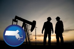 massachusetts map icon and an oil well and two oil workers at dusk