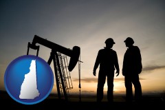 new-hampshire map icon and an oil well and two oil workers at dusk