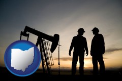ohio map icon and an oil well and two oil workers at dusk